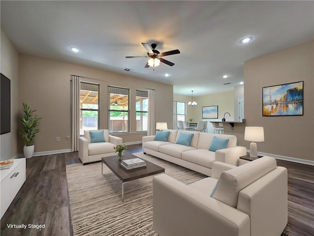 1012 Berkshire Dr, Pearl River, LA 70452 - living room with visible vents, ceiling fan, baseboards, and dark wood finished floors
