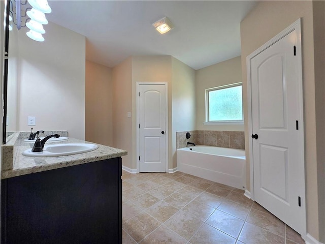 1012 Berkshire Dr, Pearl River, LA 70452 - full bathroom with tile patterned floors, vanity, a bath, and baseboards