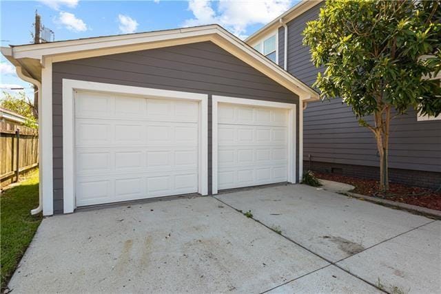detached garage with fence