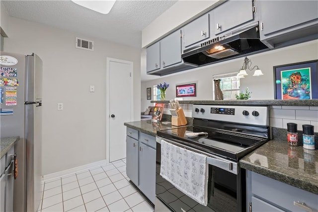 kitchen with freestanding refrigerator, under cabinet range hood, visible vents, stainless steel electric stove, and a textured ceiling