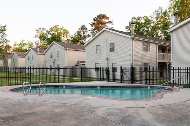 view of swimming pool with a patio, fence, cooling unit, and a fenced in pool