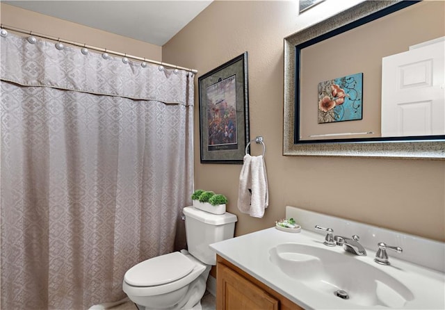 full bathroom with vanity and toilet