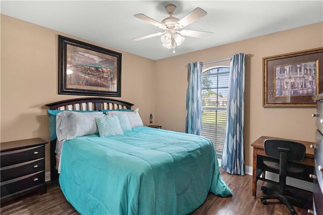 bedroom featuring dark wood-type flooring, a ceiling fan, and baseboards