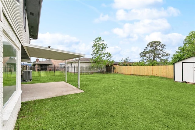 7230 Bullard Ave, New Orleans, LA 70128 - view of yard featuring a patio area, a storage unit, an outdoor structure, and central AC unit