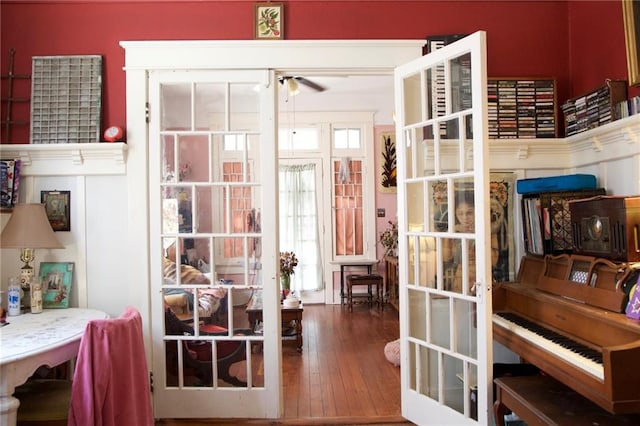 living area featuring french doors, a ceiling fan, and hardwood / wood-style floors