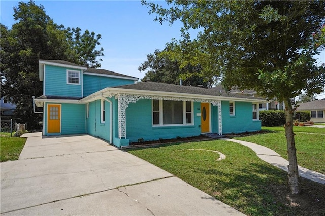 1300 Granada Dr, New Orleans, LA 70122 - view of front of house featuring fence, concrete driveway, brick siding, and a front lawn