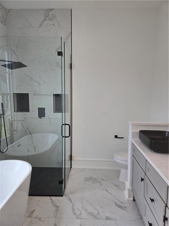 5453 Chartres St, New Orleans, LA 70117 - full bath with marble finish flooring, a freestanding tub, vanity, and a marble finish shower