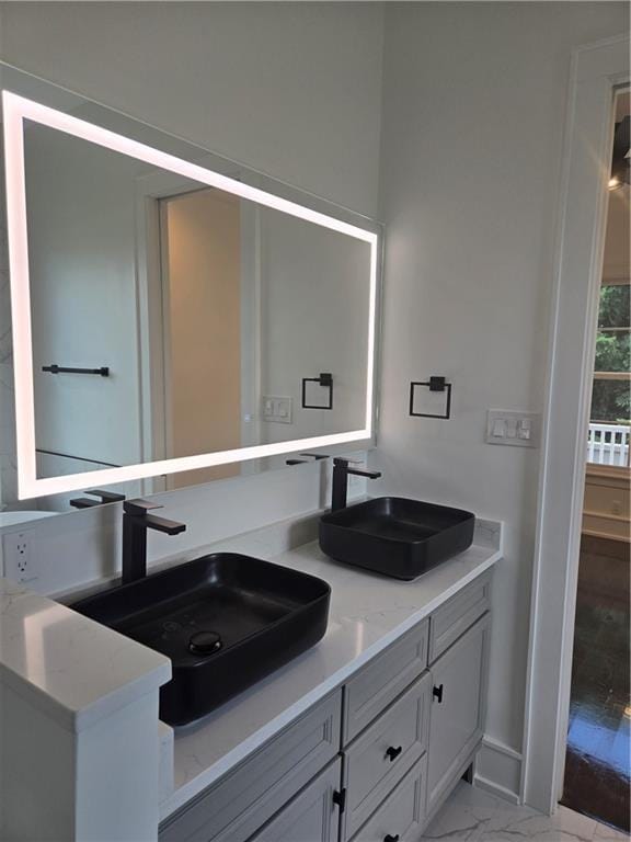 5453 Chartres St, New Orleans, LA 70117 - full bath with double vanity and marble finish flooring