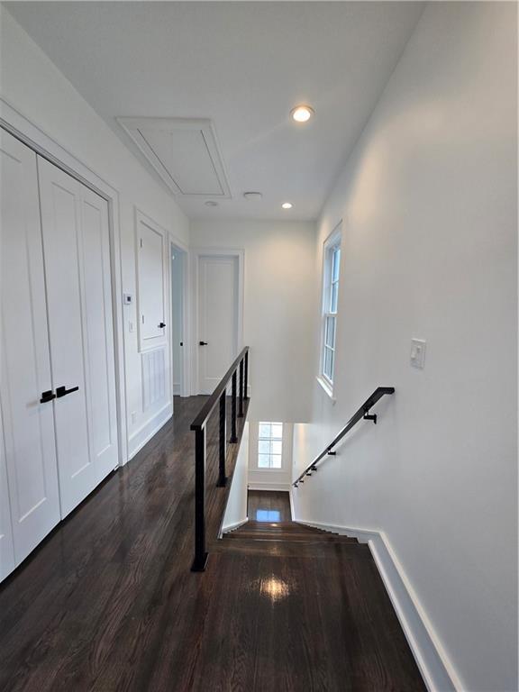 5453 Chartres St, New Orleans, LA 70117 - corridor with attic access, an upstairs landing, wood finished floors, and recessed lighting