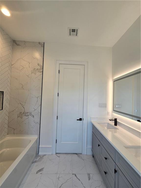 5453 Chartres St, New Orleans, LA 70117 - full bath featuring double vanity, marble look tiles, and recessed lighting