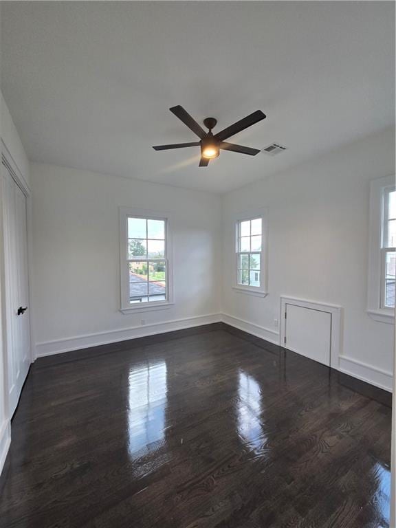 5453 Chartres St, New Orleans, LA 70117 - empty room with ceiling fan and dark wood-style floors