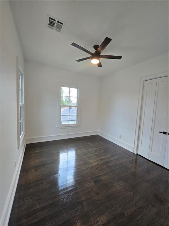 5453 Chartres St, New Orleans, LA 70117 - spare room featuring a ceiling fan and dark wood finished floors