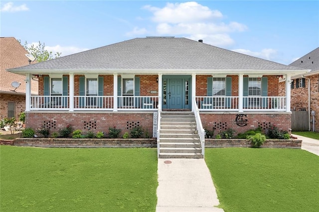 4435 Francecso Rd, New Orleans, LA 70129 - view of front of house with covered porch, brick siding, a front lawn, and stairs