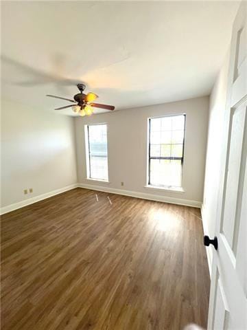 248 Cherokee St Unit 30, New Orleans, LA 70118 - unfurnished room featuring baseboards, wood finished floors, and healthy amount of natural light