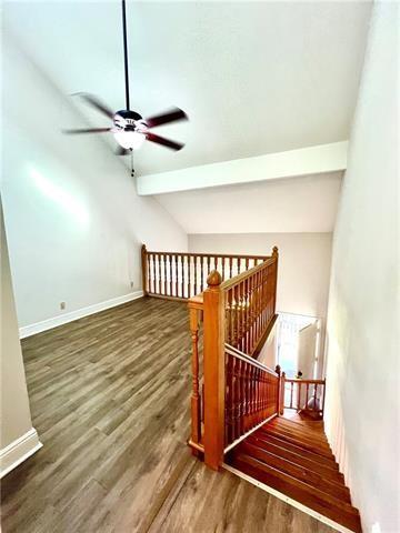 248 Cherokee St Unit 30, New Orleans, LA 70118 - staircase featuring wood finished floors, a ceiling fan, and baseboards