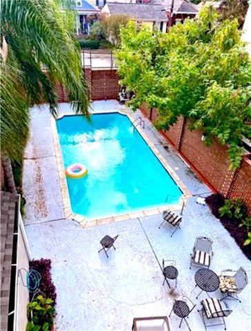 248 Cherokee St Unit 30, New Orleans, LA 70118 - view of swimming pool with a patio area and a fenced backyard