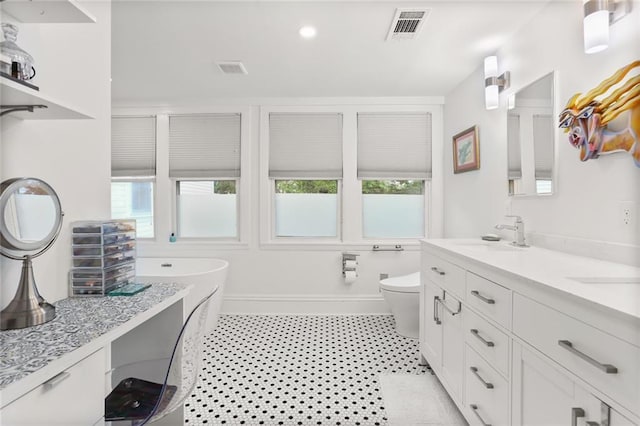2639 Desoto St, New Orleans, LA 70119 - full bathroom with a wealth of natural light, visible vents, toilet, and a sink