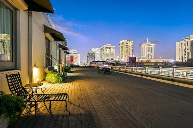 deck at dusk with a city view
