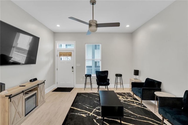 4228 Erato St, New Orleans, LA 70125 - living area with light wood-style floors, a ceiling fan, recessed lighting, and baseboards