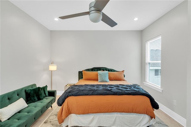 4228 Erato St, New Orleans, LA 70125 - bedroom featuring wood finished floors, baseboards, a ceiling fan, and multiple windows
