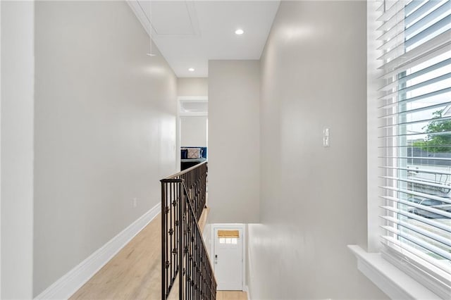 4228 Erato St, New Orleans, LA 70125 - corridor with an upstairs landing, light wood-style floors, baseboards, attic access, and recessed lighting