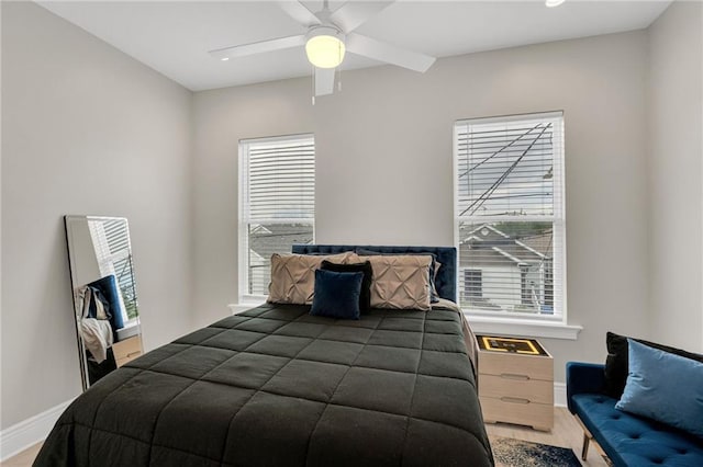 4228 Erato St, New Orleans, LA 70125 - bedroom featuring baseboards, wood finished floors, and ceiling fan