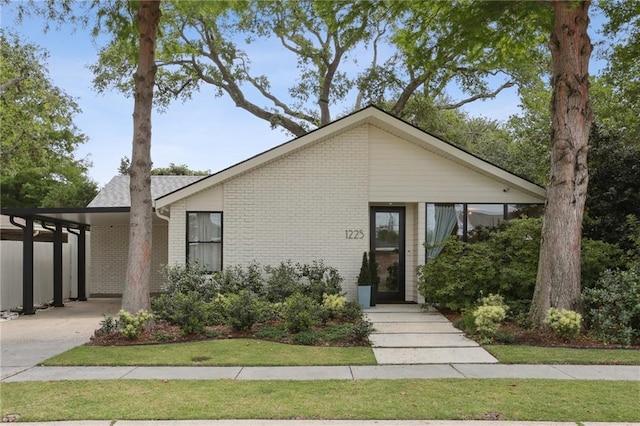 view of front of home featuring brick siding