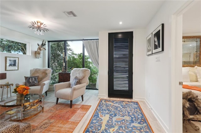 entrance foyer featuring recessed lighting, visible vents, light wood-style flooring, and baseboards