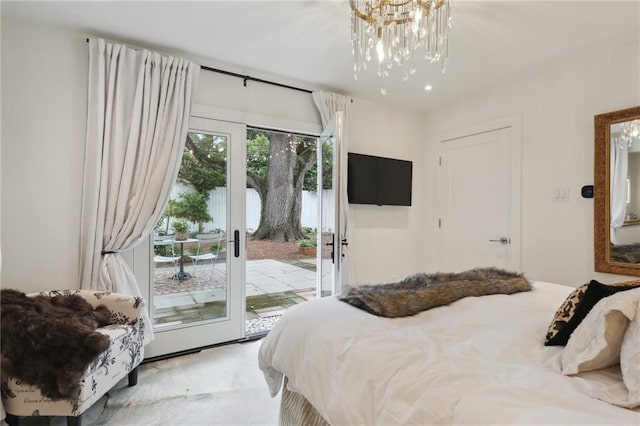 carpeted bedroom featuring a chandelier and access to outside