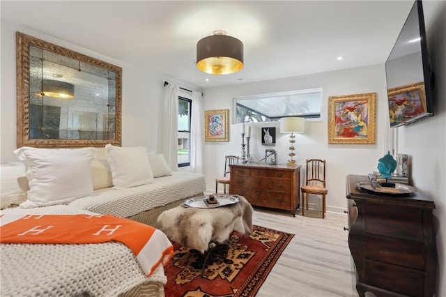 bedroom featuring recessed lighting, light wood finished floors, and baseboards