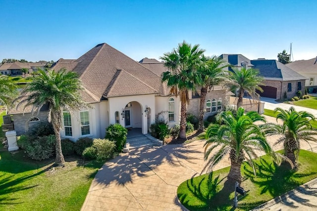 1270 Cutter Cv, Slidell, LA 70458 - view of front of home with stucco siding, driveway, and a garage