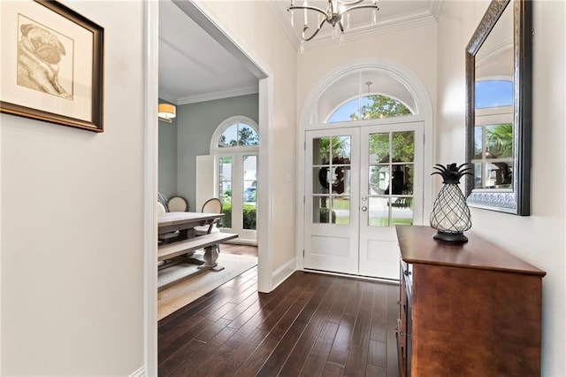 274 W Longview Ct, Madisonville, LA 70447 - foyer featuring french doors, a notable chandelier, crown molding, baseboards, and dark wood-style floors