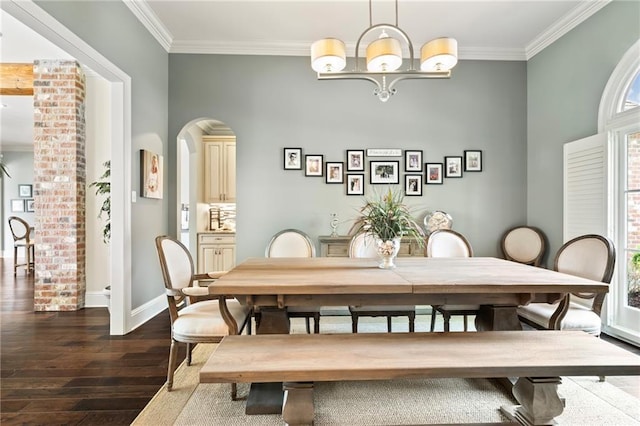 274 W Longview Ct, Madisonville, LA 70447 - dining space featuring ornamental molding, dark wood-type flooring, arched walkways, and a notable chandelier