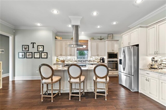 274 W Longview Ct, Madisonville, LA 70447 - kitchen featuring light stone counters, stainless steel appliances, a breakfast bar area, and island exhaust hood
