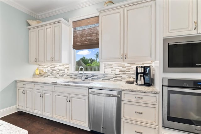 274 W Longview Ct, Madisonville, LA 70447 - kitchen featuring a sink, tasteful backsplash, appliances with stainless steel finishes, light stone counters, and dark wood-style floors