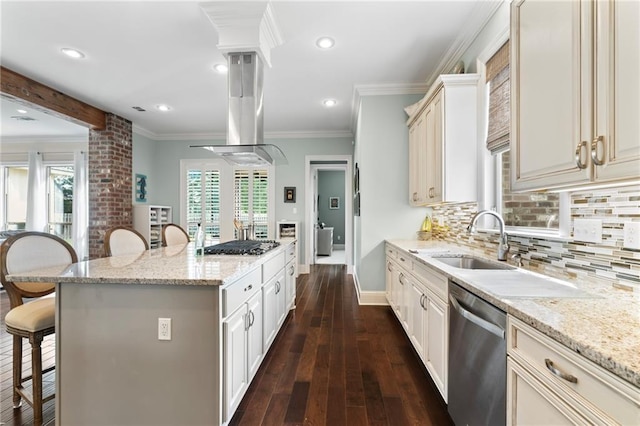 274 W Longview Ct, Madisonville, LA 70447 - kitchen with a sink, ornate columns, a breakfast bar area, and appliances with stainless steel finishes