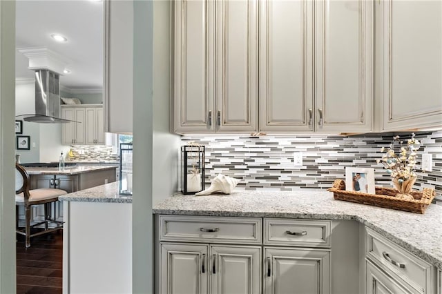 274 W Longview Ct, Madisonville, LA 70447 - kitchen featuring extractor fan, tasteful backsplash, wood finished floors, ornamental molding, and light stone counters