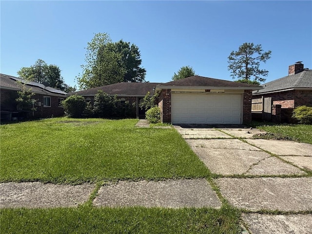 ranch-style home with brick siding and a front yard