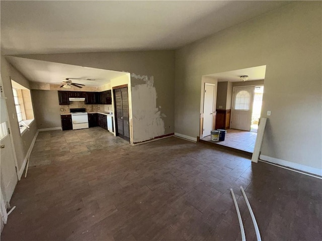 unfurnished living room with baseboards, a ceiling fan, dark wood-style flooring, and lofted ceiling