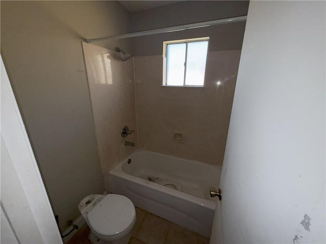 bathroom with tile patterned floors, toilet, and shower / bath combination