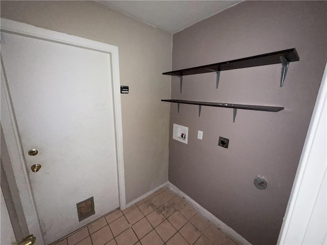 laundry room with hookup for an electric dryer, light tile patterned floors, baseboards, hookup for a washing machine, and laundry area