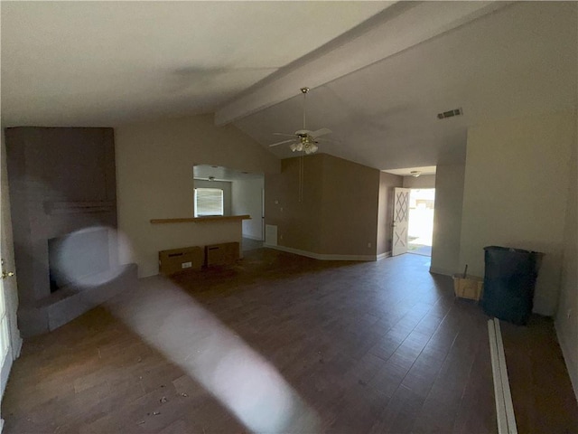 unfurnished living room featuring a wealth of natural light, vaulted ceiling with beams, a ceiling fan, visible vents, and wood finished floors
