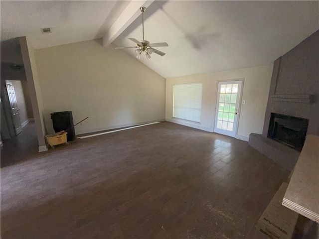 unfurnished living room with a brick fireplace, lofted ceiling with beams, a ceiling fan, baseboards, and wood finished floors