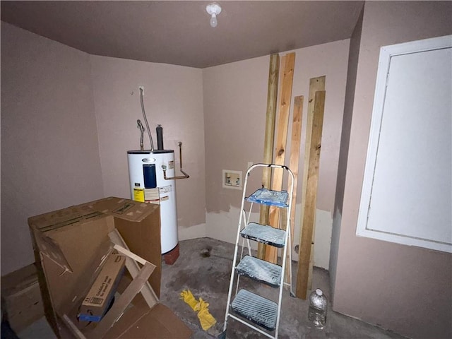 misc room featuring concrete flooring and electric water heater