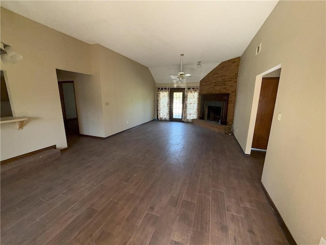 unfurnished living room featuring dark wood-type flooring, a ceiling fan, a fireplace, and lofted ceiling