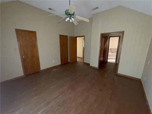 interior space featuring visible vents, ceiling fan, dark wood-style floors, and baseboards