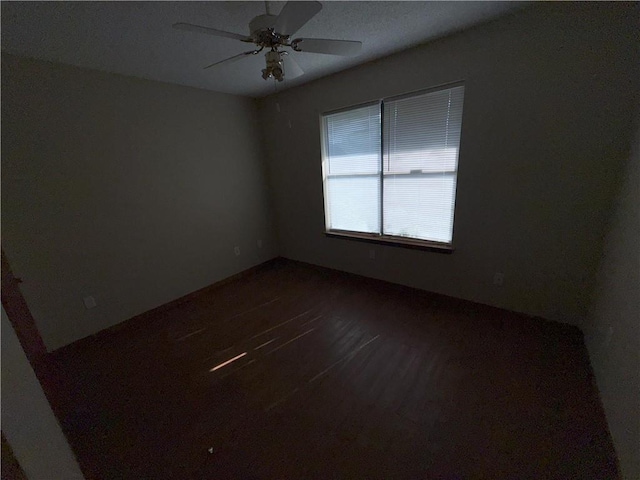 spare room with a ceiling fan