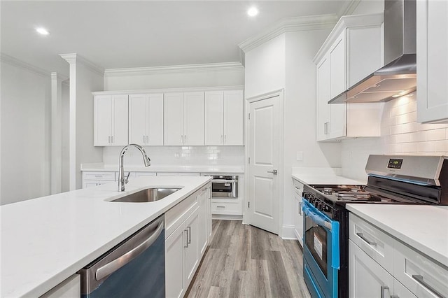 1504 Mason Smith Ave, Metairie, LA 70003 - kitchen with a sink, light countertops, wall chimney exhaust hood, stainless steel appliances, and ornamental molding