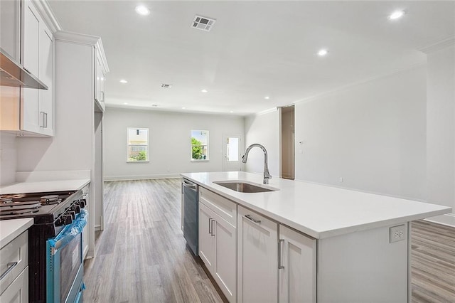 1504 Mason Smith Ave, Metairie, LA 70003 - kitchen featuring appliances with stainless steel finishes, light wood-type flooring, a sink, light countertops, and recessed lighting