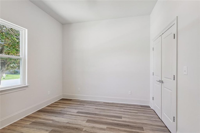 1504 Mason Smith Ave, Metairie, LA 70003 - spare room featuring baseboards, plenty of natural light, and light wood-type flooring